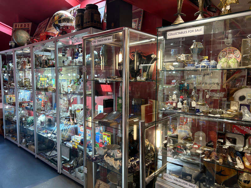 Antiques for sale in glass cabinet