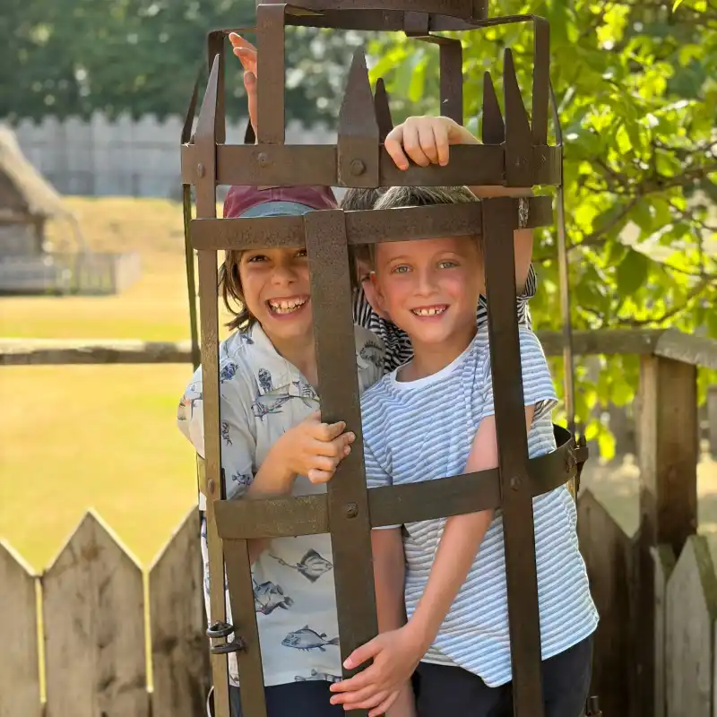 Boys in metal cage at the castle