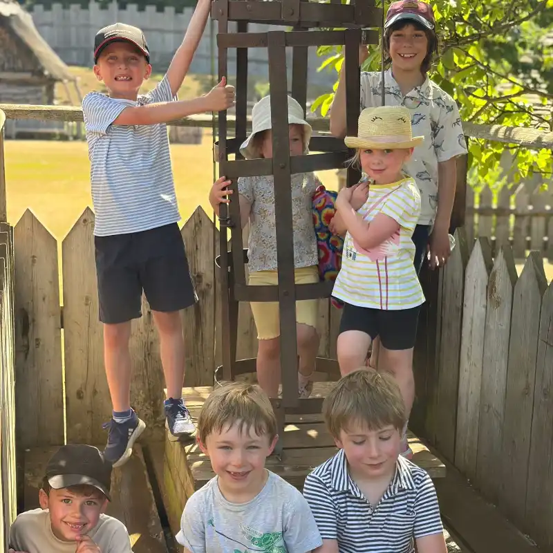 Kids at Mountfitchet Castle with girl in cage